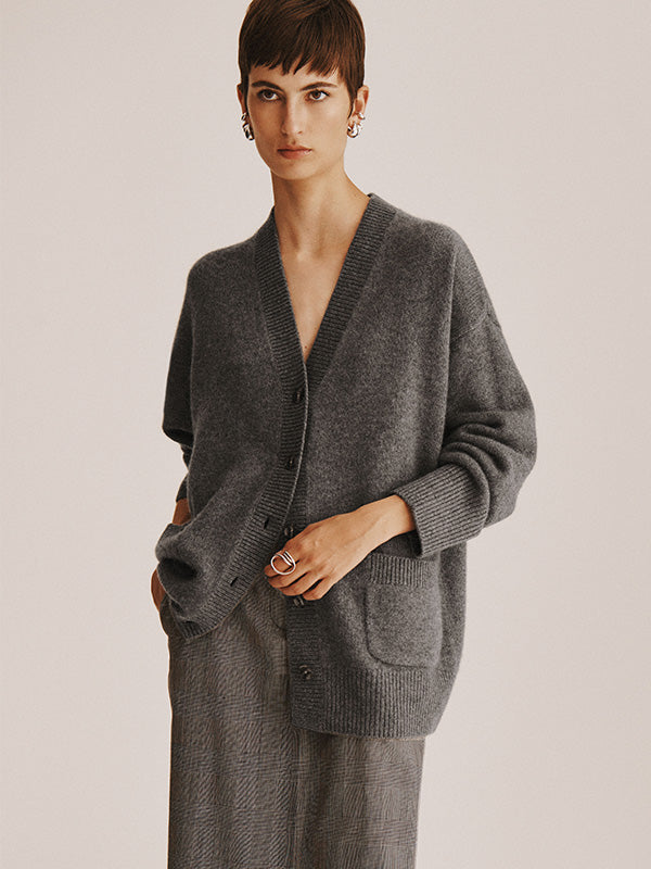 Model wears White + Warren’s Cashmere Luxe Pocket Cardigan with layered bottoms in studio.
